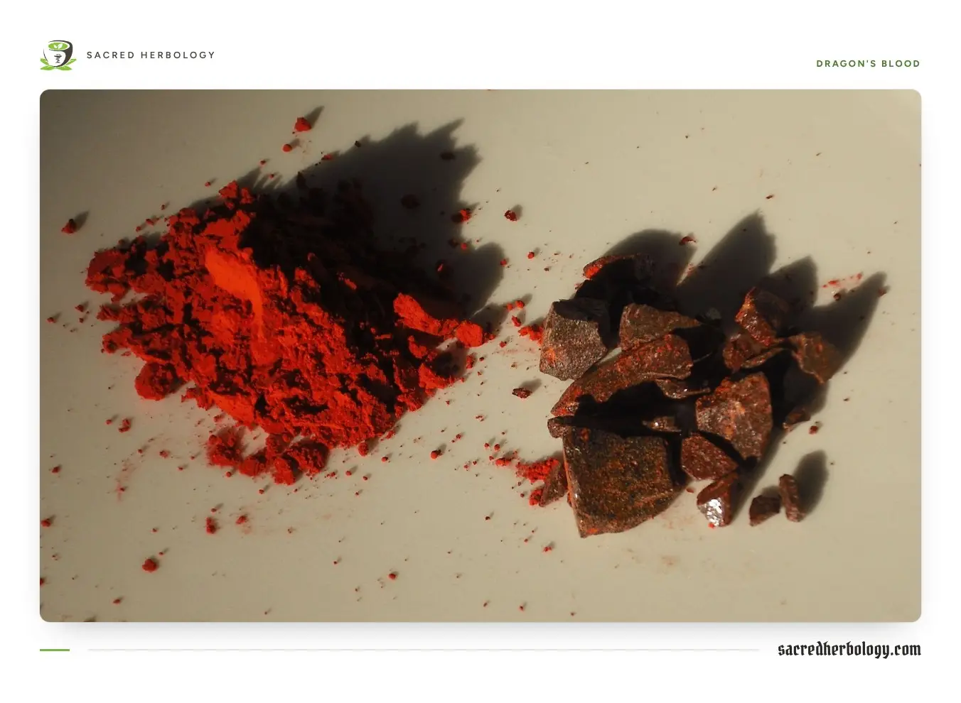 A small heap of bright orange-red powder beside a pile of dark red, glassy broken resin lumps on a pale surface